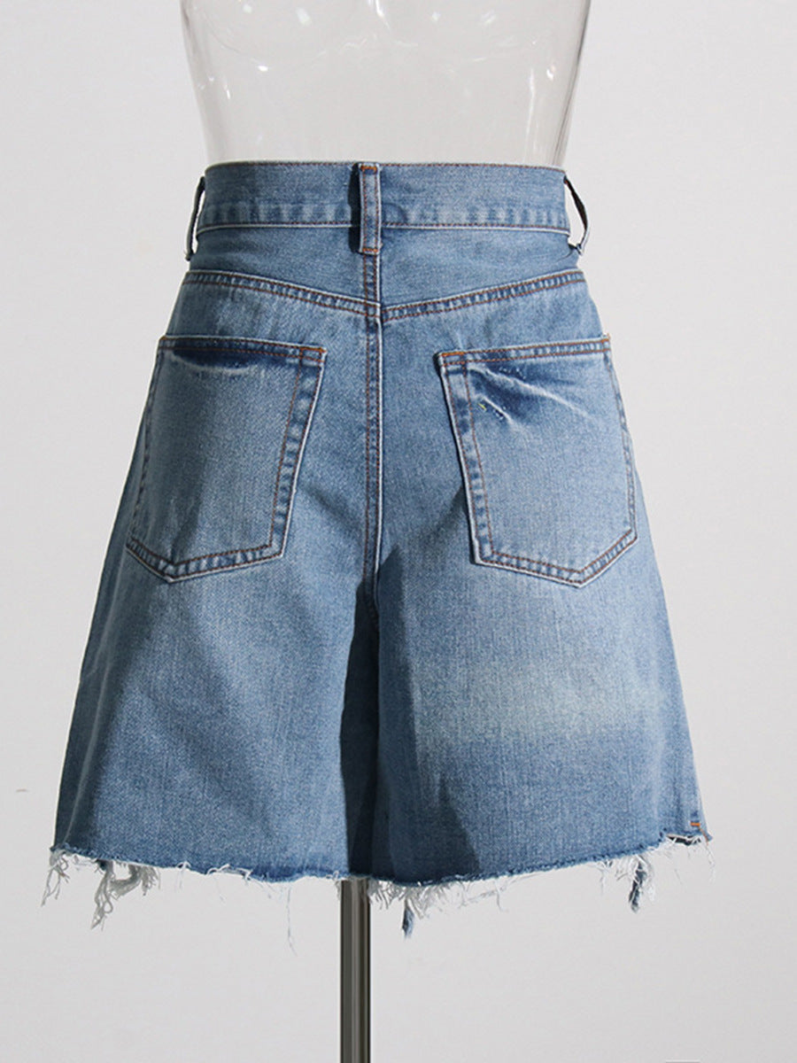 Street cool American ripped jeans 2026 spring new cross strap irregular design ripped jeans