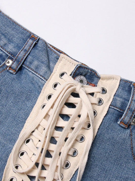 Street cool American ripped jeans 2026 spring new cross strap irregular design ripped jeans